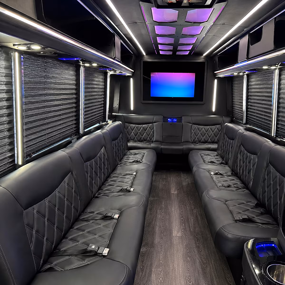 Friends laughing during a party bus celebration in Modesto